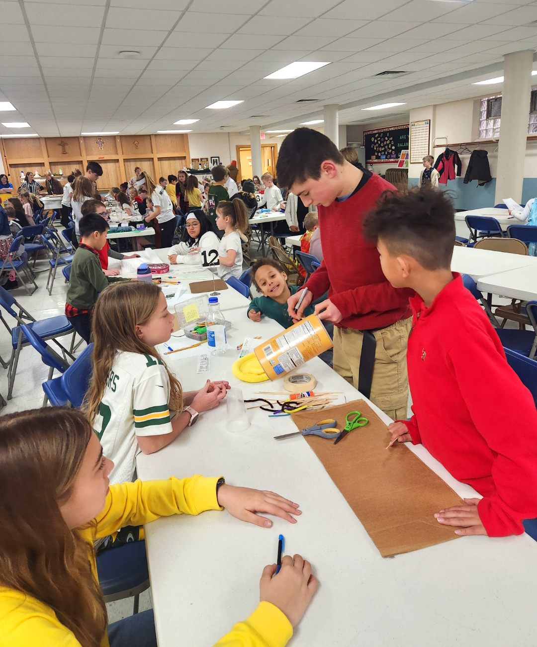 Joshua Gonzalez with his students in classroom